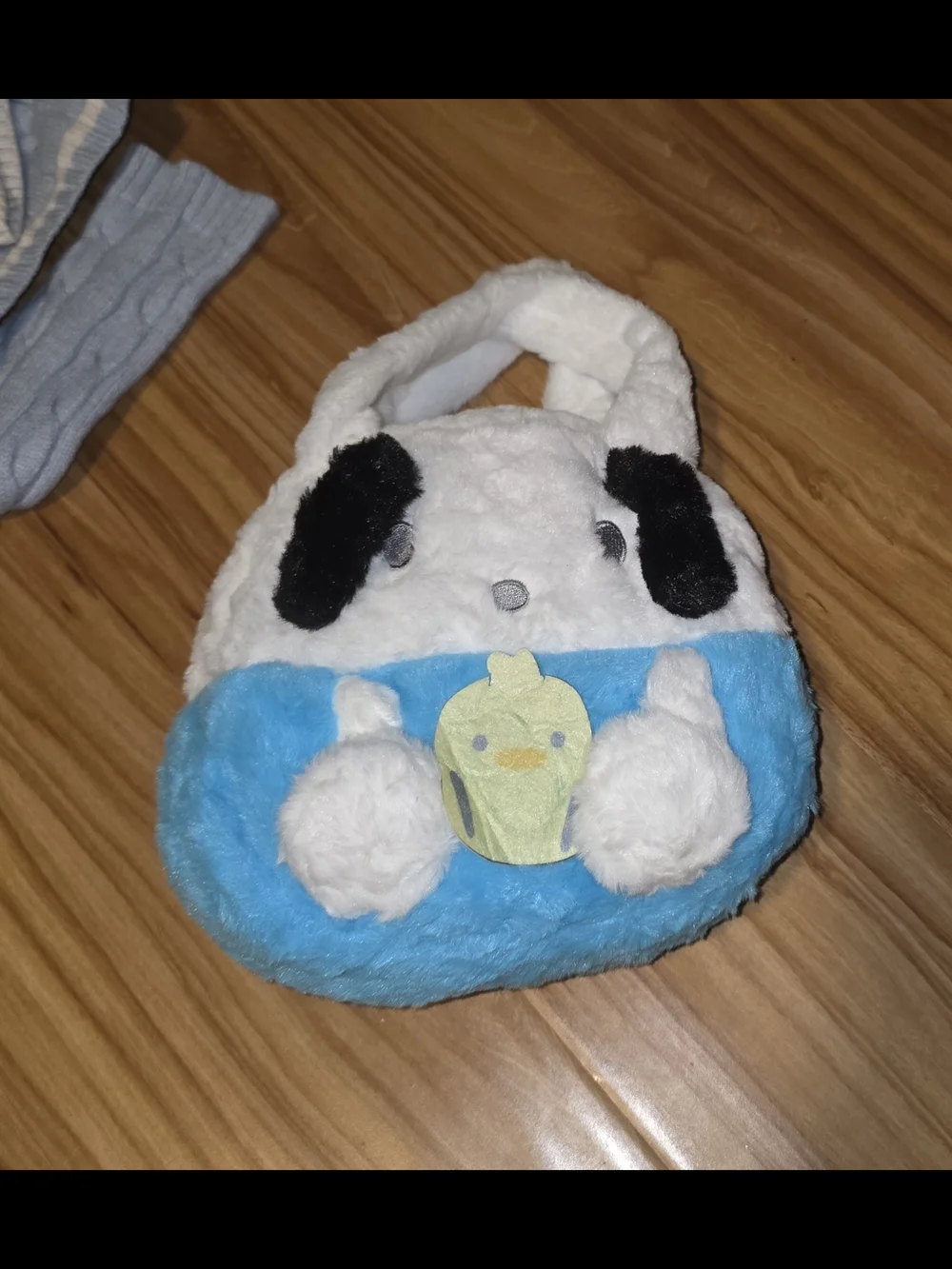 Sanrio Hello Kitty white and blue plush handbag with black ears and a yellow cup